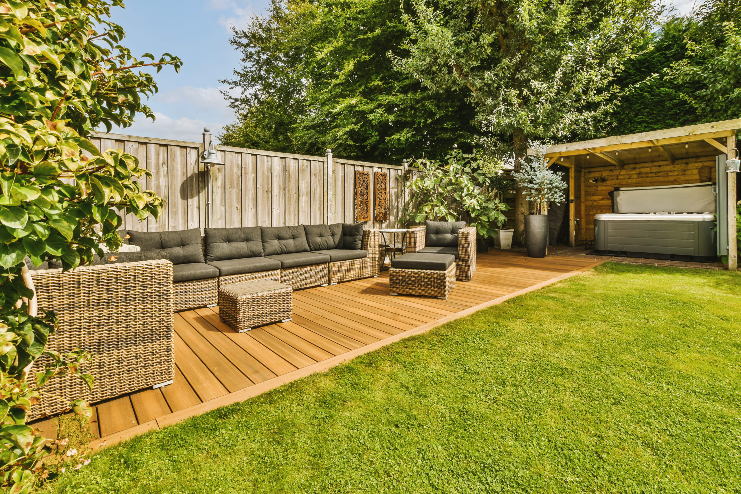 Neat patio with sitting area Wooden fencing materials for domestic gardens